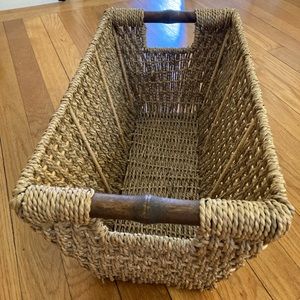 Woven basket with wooden handles